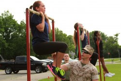 Janna Smith, an 18 year old Marine Corps poolee from Recruiting Sub-Station Livonia, conducts the flexed-arm hang during Recruiting Station Detroit’s bi-annual female pool function at the Boys and Girls Club of Troy, Mich., June 20, 2015. The flexed arm hang is the first of three events the poolees performed during their Initial Strength Test. (U.S. Marine Corps photo by Cpl. J.R. Heins/Released)