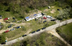 This aerial photo shows one of the locations being investigated in Pike County, Ohio, as part of an ongoing homicide investigation, Friday, April 22, 2016. Several people were found dead Friday at multiple crime scenes in rural Ohio, and at least most of them were shot to death, authorities said. No arrests had been announced, and it's unclear if the killer or killers are among the dead. (Lisa Marie Miller/The Columbus Dispatch via AP) MANDATORY CREDIT