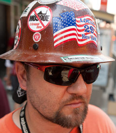 construction worker against mosque
