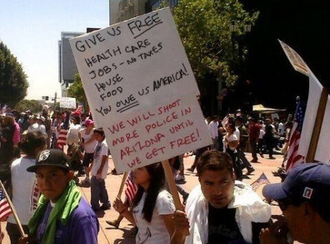 immigration law protest sign
