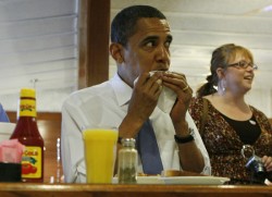 A credit to the women who raised him, the President uses his napkin to gently wipe his mouth. Children of America, take note!